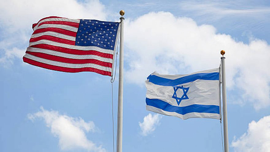 United States & Israeli flags wave together in unison symbolizing concepts such as the American/Israeli bond and Judaism in America. Here are some related images: