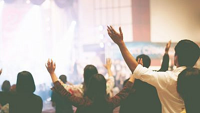 Christian worshippers. Credit: Jantanee Runpranomkorn/Shutterstock.