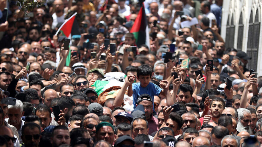 Mourners carry the body of Palestinian human-rights activist Nizar Banat, who died a short time after being arrested by Palestinian Authority security forces, in Hebron, on June 25, 2021. Photo by Wisam Hashlamoun/Flash90.