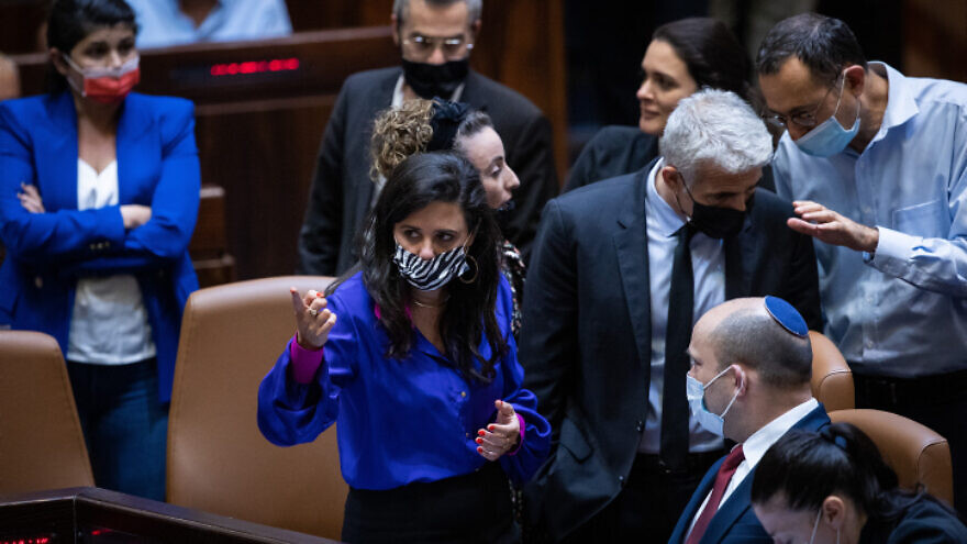 Israeli Interior Minister Ayelet Shaked (center), Prime Minister Naftali Bennett (bottom right) and Foreign Minister Yair Lapid (second from right) at the Knesset,. July 6, 2021. Photo by Yonatan Sindel/Flash90.