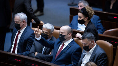 (L-R) Israeli minister of Defense Benny Gantz, minister of Foreign Affairs Yair Lapid, Prime Minister Naftali Bennett and Minister of Justice Gideon Saar during a discussion on the "family reunification law", during a plenum session in the assembly hall of the Israeli parliament, in Jerusalem, on July 6, 2021. Photo by Yonatan Sindel/Flash90