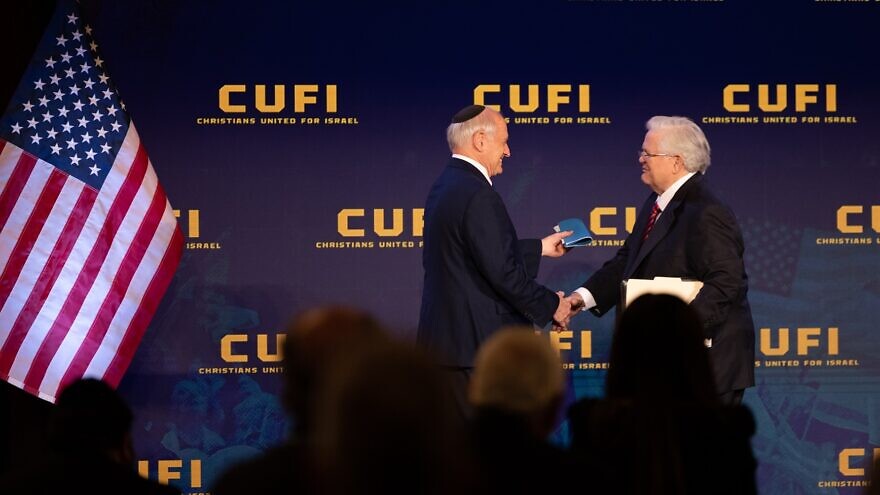 Malcolm Hoenlein, vice chairman of the Conference of Presidents of Major American Jewish Organizations, shakes hands with CUFI founder and president Pastor John Hagee, July 2021. Credit: CUFI.