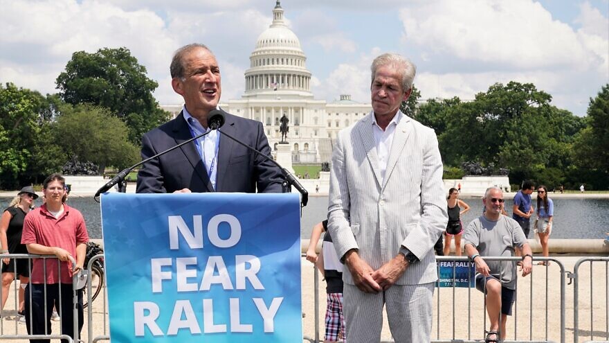 Former Rep. Ron Klein (D-Fla.), chairman of the Jewish Democratic Council of America (JDCA), speaks at the “No Fear: A Rally in Solidarity With the Jewish People” on the National Mall in Washington, D.C., on July 11, 2021. Standing at right is former Sen. Norm Coleman (R-Minn.), chairman of the Republican Jewish Coalition (RJC). Credit: Chris Kleponis