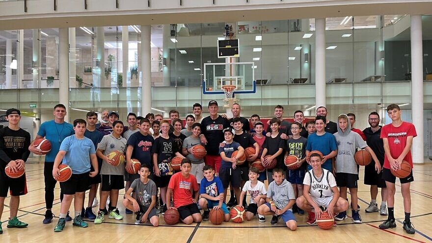 NBA Hall of Famer Rick Barry talks with kids at a basketball summer camp held at the Jerusalem International YMCA on July 8, 2021. Source: Rick Barry/Twitter.