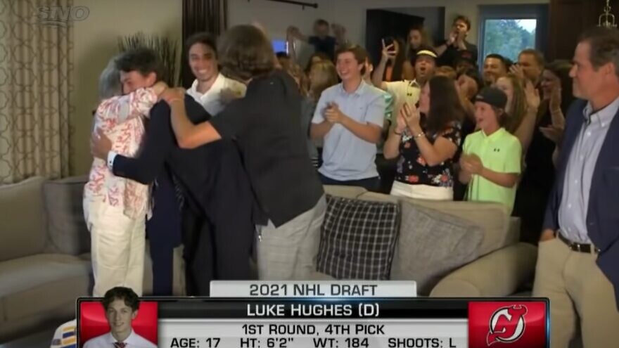 Luke Hughes celebrates with his family after being selected in the first round of the NHL draft. Source: Screenshot.