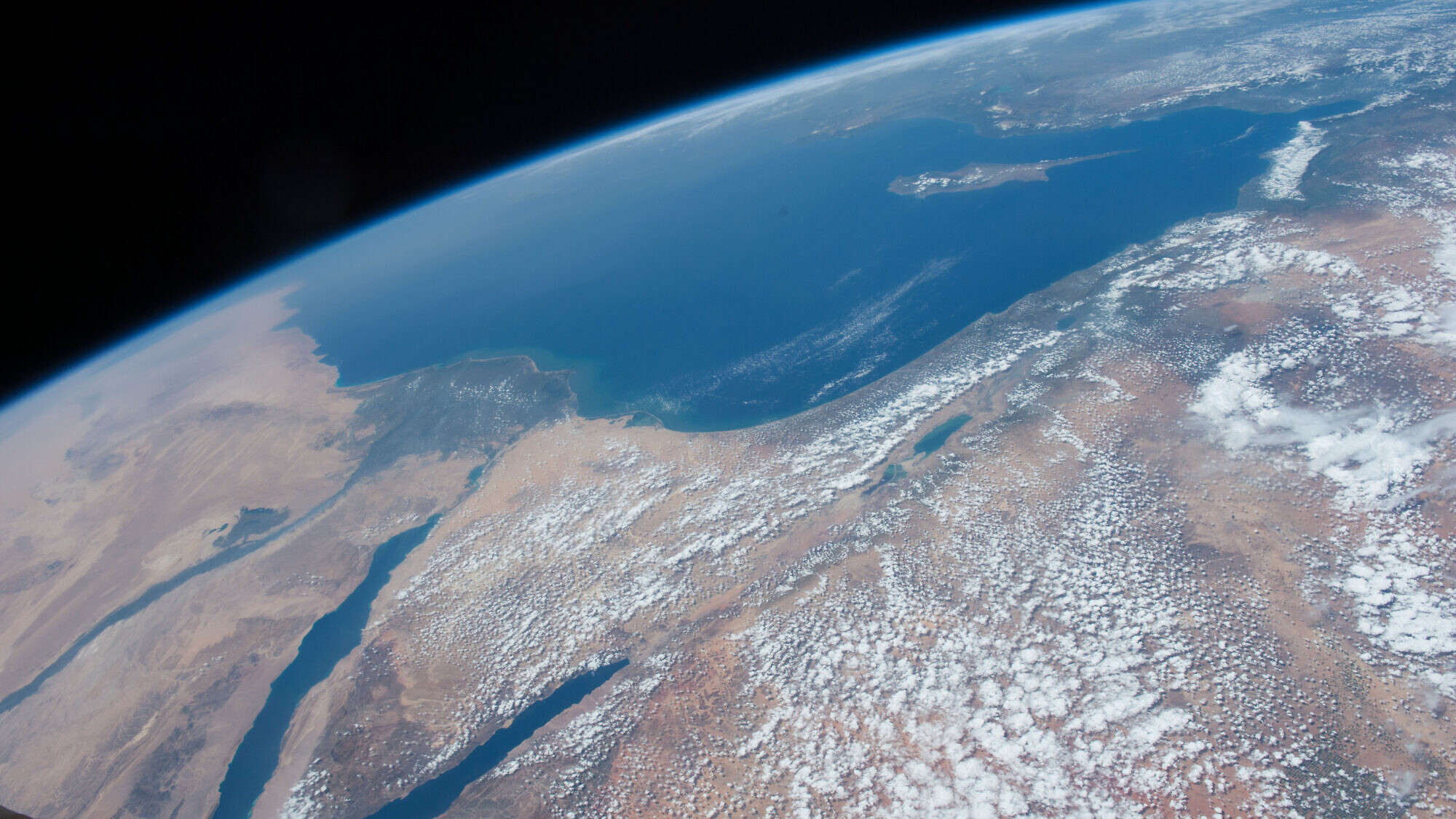 The Middle East as seen from 250 miles above in this photo from the International Space Station. Countries, from left, along the Mediterranean coast include Egypt, Gaza, Saudi Arabia, Israel, Lebanon, Syria and Turkey. The major waterways shown from left to right are the Nile River, Gulf of Suez, Gulf of Aqaba and the Red Sea, April 4, 2016. Credit: NASA on Flickr via Wikimedia Commons.