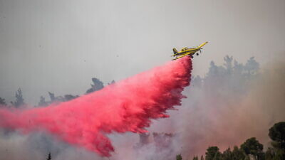 An Israeli firefighting plane battles a large forest fire near Neve Ilan, near Jerusalem, June 9, 2021. Photo by Yonatan Sindel/Flash90.