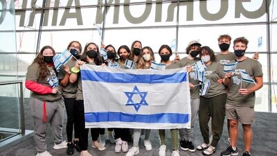 Twelve future lone soldiers from North America at Ben-Gurion Airport after their arrival on a Nefesh B’Nefesh Group Aliyah Flight, Aug. 10, 2021. Photo by Yonit Schiller.