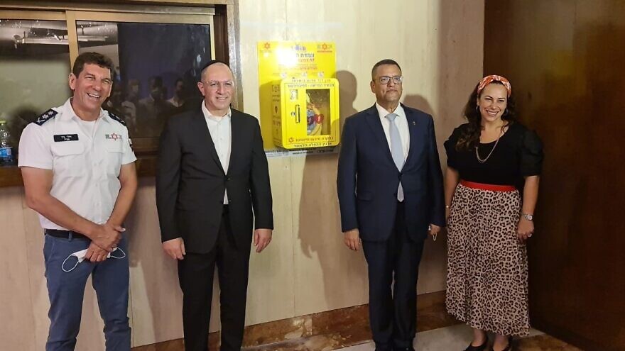From left: Magen David Adom director-general Eli Bin; Cross River Bank president, CEO and founder Gilles Gade; Jerusalem Mayor Moshe Lion; president and CEO of the International Fellowship of Christians and Jews Yael Eckstein, August 2021. Credit: Courtesy.