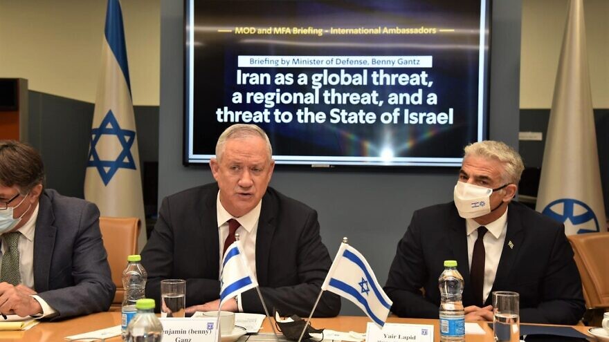 Israeli Defense Minister Benny Gantz and Foreign Minister Yair Lapid lead a briefing to ambassadors of U.N. Security Council member states on the threats Iran poses internationally on the seas and elsewhere, Aug. 4, 2021. Credit: Israel Ministry of Foreign Affairs.