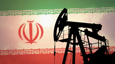 An oil pump on the background of the flag of Iran. Photo by Anton Watman/Shutterstock.