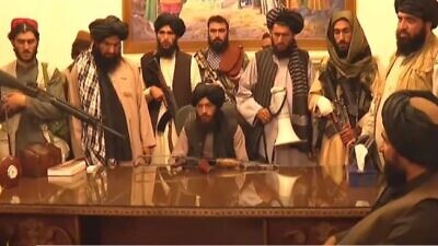 Taliban fighters inside the presidential palace in Kabul. Source: Screenshot.