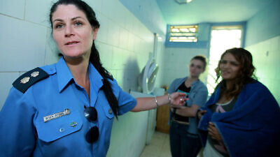 A guard speaks to inmates at Neve Tirtza, Israel's only women's prison, in Ramla. July 21, 2010. Photo by Moshe Shai/Flash90.