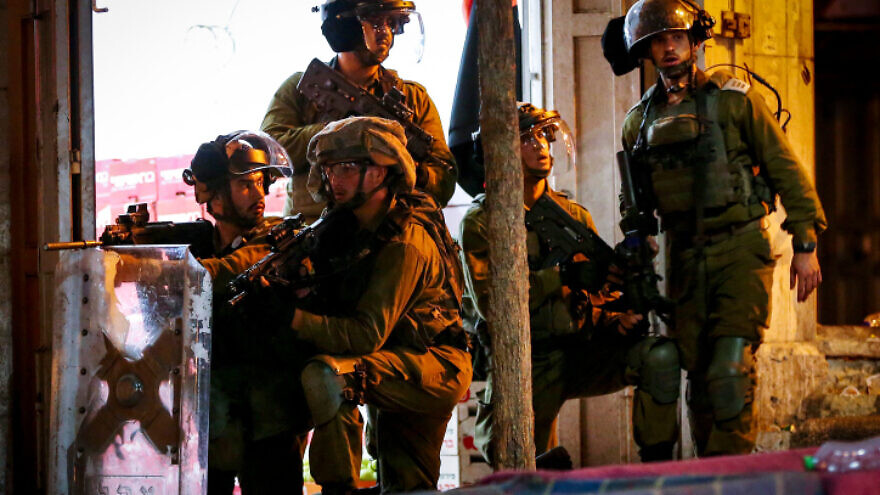 Israeli troops confront Palestinian rioters in Hebron, protesting on behalf of the six terrorists who escaped the Gilboa Prison, Sept. 8, 2021. Photo by Wisam Hashlamoun/Flash90.