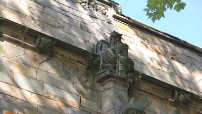 Sterling Memorial Library at Yale University in New Haven, Conn., with a statue of Moses with horns protruding from his head. Photo by Karyn Bell.