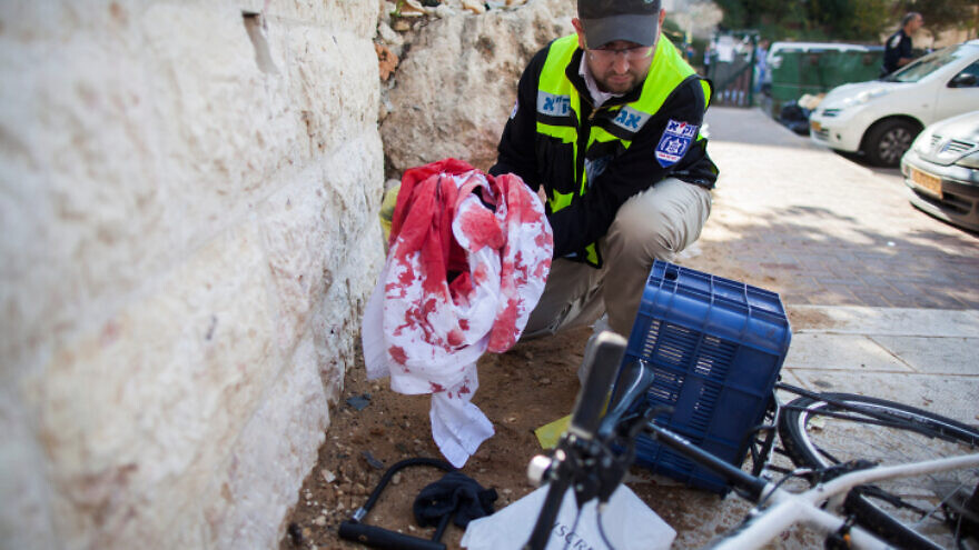 Israeli police and rescue teams at the scene of a Palestinian terrorist attack on worshipers at the Kehilat Yaakov synagogue in Jerusalem's Har Nof neighborhood, Nov. 18, 2014. Photo by Yonatan Sindel/Flash90.