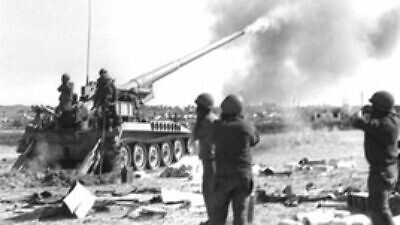 Israel Defense Forces troops firing at Syrian targets on the northern front during the 1973 Yom Kippur War. Credit: GPO.
