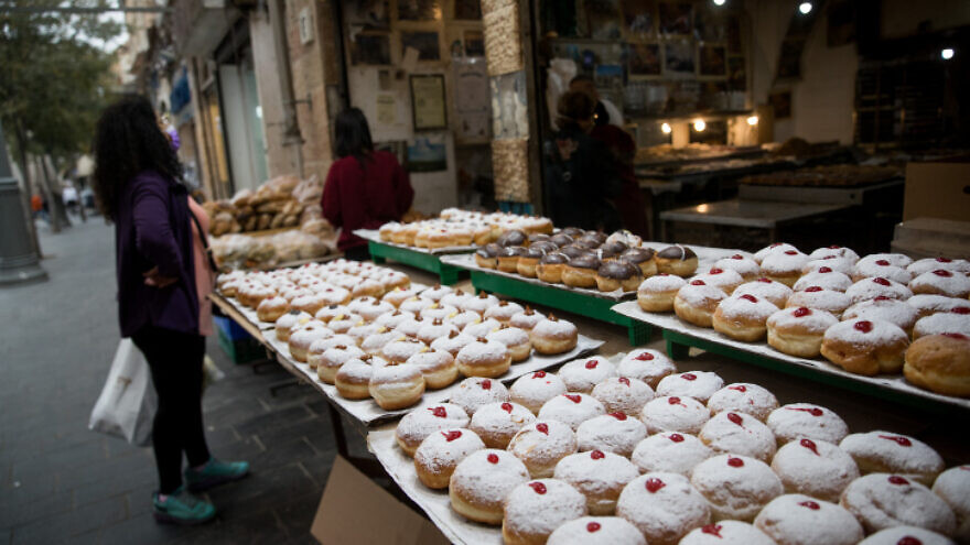 Doughnuts at the Haba bakery at Jerusalem's Machane Yehuda market ahead of Hanukkah, Dec. 7, 2020. Photo by Yonatan Sindel/Flash90.
