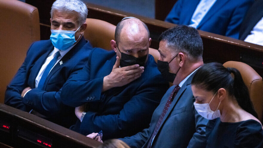 From left: Israeli Foreign Minister Yair Lapid, Prime Minister Naftali Bennett, Justice Minister Gideon Sa'ar and Transportation Minister Merav Michaeli attend a plenary session at the Knesset assembly hall, June 28, 2021. Photo by Olivier Fitoussi/Flash90.