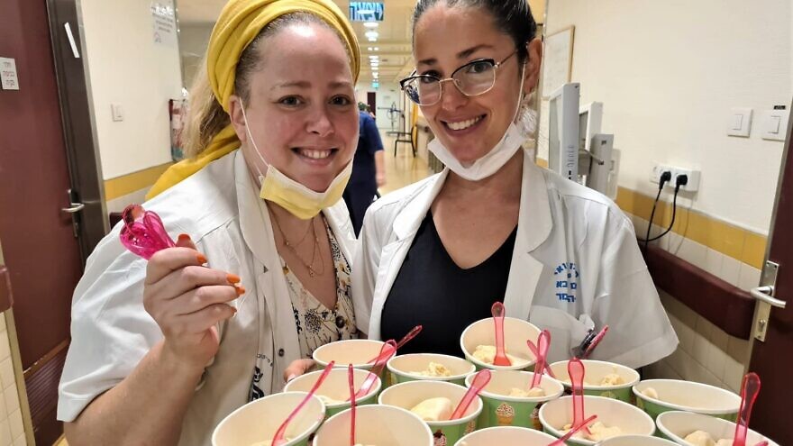 Sheba Medical Center dietitians Meital Benjamin (left) and Ayelet Gur-Arie deliver supplements to patients blended into ice-cream. Credit: Courtesy.