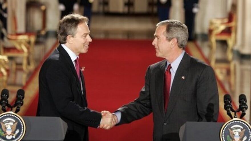 U.S. President George W. Bush and British Prime Minister Tony Blair shake hands after their press conference in the East Room of the White House on Nov. 12, 2004. Credit: White House Photo by Paul Morse.