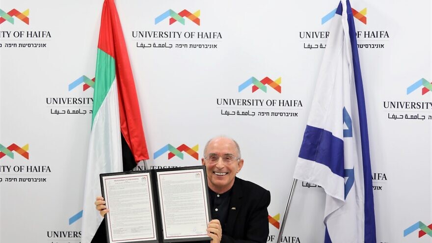 University of Haifa president Ron Rubin signs a Memorandum of Understanding (MoU) with Zayed University in Abu Dhabi, for joint research and exchange programs, Nov. 3, 2021. Credit: Courtesy.