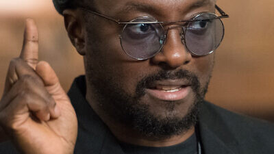 Black Eyed Peas band member Will.i.am is interviewed by NASA TV at the John F. Kennedy Center for the Performing Arts ahead of the “National Symphony Orchestra Pops: Space, the Next Frontier,” celebrating NASA's 60th Anniversary in Washington, on June 1, 2018. Credit: NASA/Aubrey Gemignani via Wikimedia Commons.