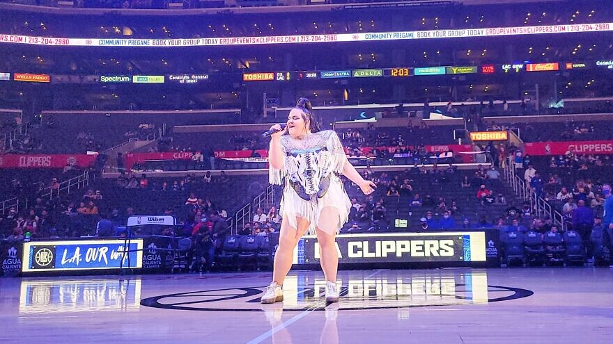 Israeli singer Netta Barzilai performs at the Staples Center in Los Angeles during a Hanukkah celebration on the second night of the holiday, Nov. 29, 2021. Credit: Courtesy of the Consulate General of Israel.