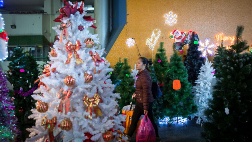 Shoppers at a Christmas market at the Central Bus Station in South Tel Avivon Dec. 9, 2018. Photo by Miriam Alster/Flash90.