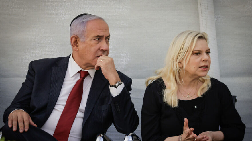 Former Israeli Prime Minister Benjamin Netanyahu and his wife, Sara, attend a memorial ceremony for Netanyahu's brother, Yoni Netanyahu, at the Mount Herzl Military Cemetery, in Jerusalem, on June 16, 2021. Photo by Olivier Fitoussi/Flash90.