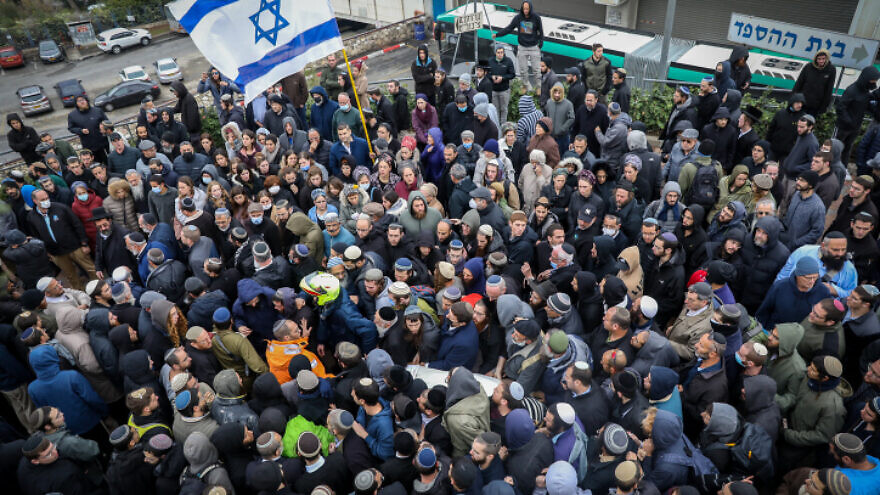 Family and friends attend the funeral of 25-year-old yeshivah student Yehuda Dimentman, who was shot and killed in a Palestinian terror attack near Homesh, at Har HaMenuchot cemetery in Jerusalem on Dec. 17, 2021. Photo by Noam Revkin Fenton/Flash90