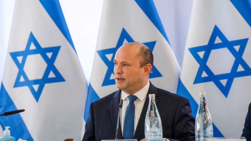 Israeli Prime Minister Naftali Bennett leads a Cabinet meeting at Kibbutz Mevo Hama on Dec. 26, 2021. Photo by Gil Eliyahu/POOL.
