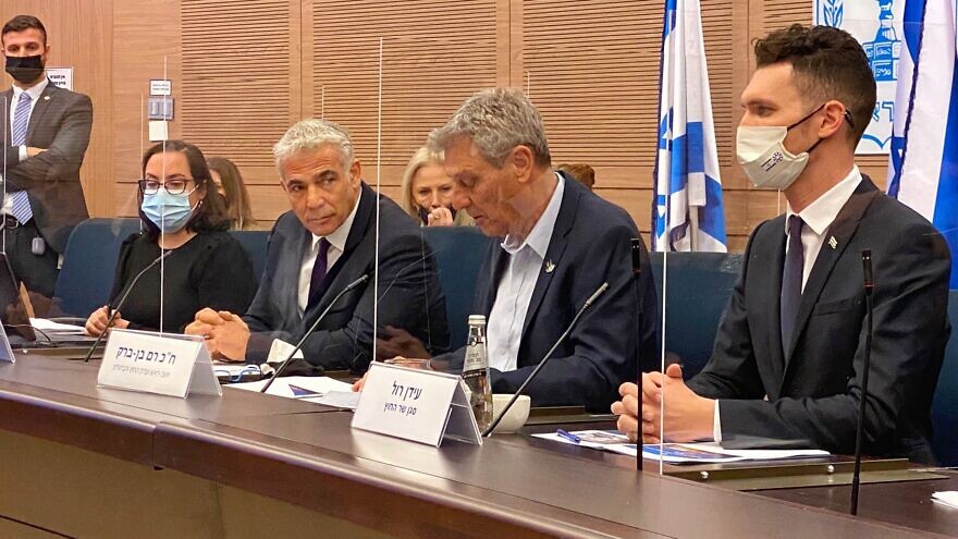 Israeli Foreign Minister Yair Lapid (third from right) at a meeting of the Knesset's Foreign Affairs and Defense Committee on Dec. 27, 2027. Source: Twitter.