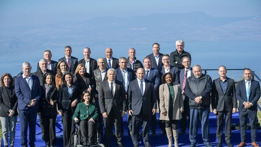 Israeli Cabinet members pose for a picture in Kibbutz Mevo Hama in the southern Golan Heights, Dec. 26, 2021. Photo by Kobi Gideon/GPO.