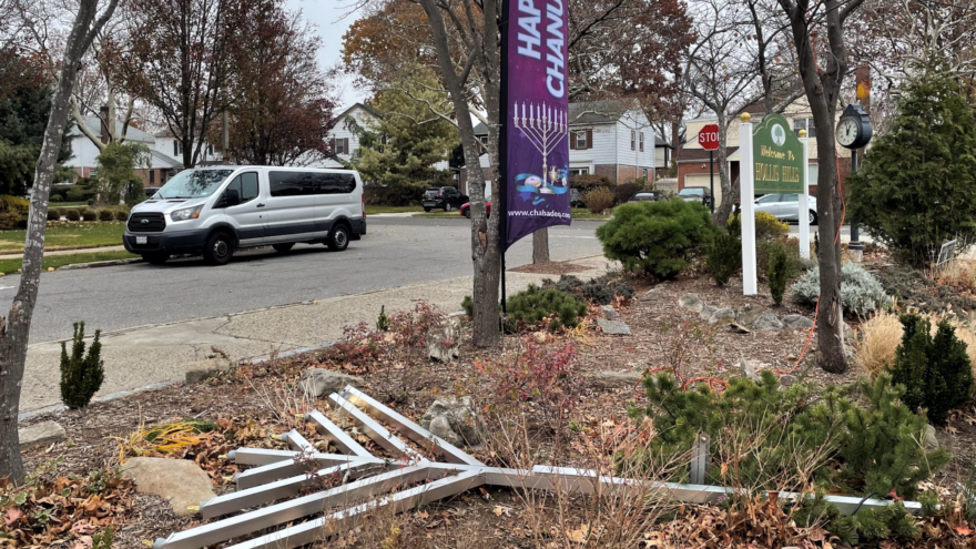 A menorah erected by Chabad of Eastern Queens, N.Y., during Hanukkah 2021 was knocked down, the second time a menorah placed at that particular location in the Hollis Hills neighborhood was damaged; the first incident occurred in 2014. Source: Twitter/New York State Sen. John C. Lui.
