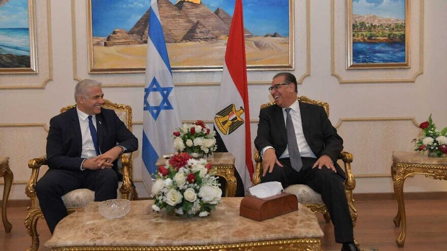 Israeli Foreign Minister Yair Lapid with Egyptian President Abdel Fattah El-Sisi in Cairo on Dec. 9, 2021. Photo by Shlomi Amsalem.
