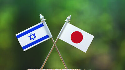 Israeli and Japanese flags. Photo by Aritra Deb/Shutterstock.