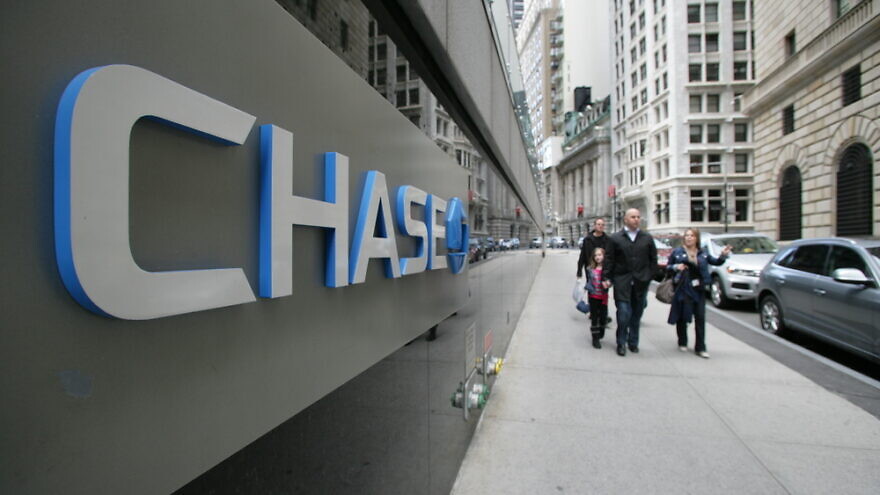 Pedestrians walk past the headquarters of Chase Manhattan Bank in New York City, on Friday, April 19, 2013. Credit: Northfoto/Shutterstock.