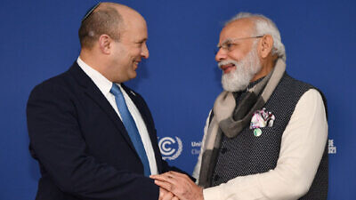 Israeli Prime Minister Naftali Bennett meets with Indian Prime Minister Narendra Modi at the U.N. Climate Change Conference in Glasgow, Scotland, on Nov. 2, 2021. Credit: GPO/Haim Zach,