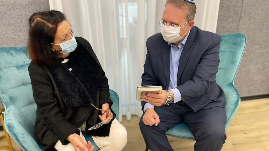 Acting Jewish Agency chairman Yaakov Hagoel with Holocaust survivor Mariah Krupievsky, whose father, Israel Nissman, was murdered by the Nazis in 1941 when they lived in Chernivtsi. In the picture, Hagoel uploaded his name to an Instagram story as part of the Jewish Agency and World Zionist Organization’s "Forever in their Name" campaign. Credit: Jewish Agency for Israel.