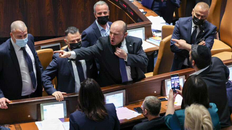 Israeli Prime Minister Naftali Bennett argues with opposition members during a vote on the controversial "electricity bill" at the Knesset in Jerusalem on Jan. 5, 2022. Photo by Yonatan Sindel/Flash90.