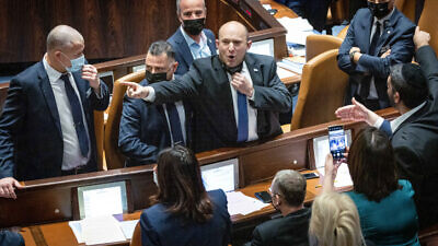 Israeli Prime Minister Naftali Bennett reacts during a stormy discussion of the Electricity Law, during a Knesset plenum session, Jan. 5, 2022. Photo by Yonatan Sindel/Flash90.