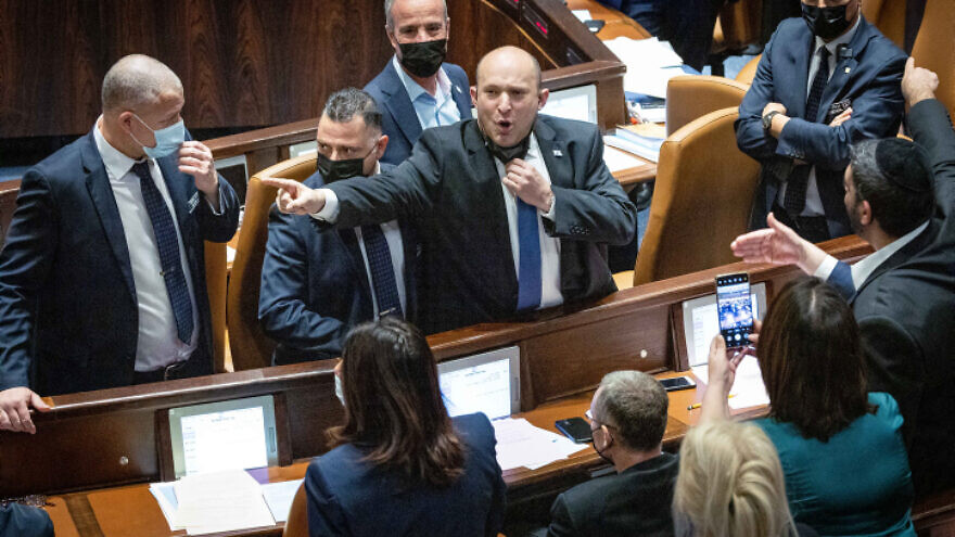 Israeli Prime Minister Naftali Bennett reacts during a stormy discussion of the Electricity Law, during a Knesset plenum session, Jan. 5, 2022. Photo by Yonatan Sindel/Flash90.