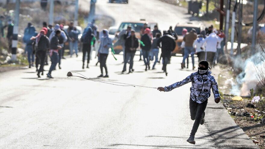 Palestinian protesters clash with Israeli security forces near Ramallah, in the West Bank. on Jan. 11, 2022. Photo by Flash90.