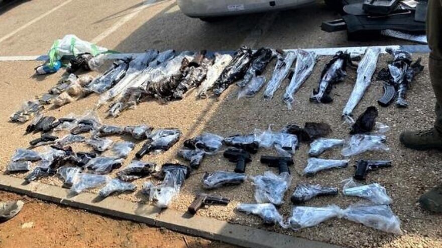 A total of 53 firearms were by Israeli security forces after intercepting three suspicious vehicles near Route 90 on Jan. 25, 2022. Credit: IDF Spokesperson's Unit.