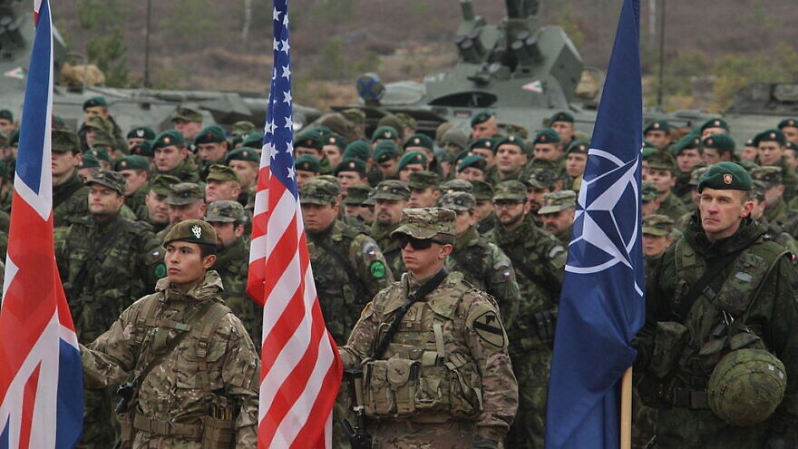U.S. soldiers participate in closing ceremonies for Iron Sword 2014 in Pabrade, Lithuania, Nov. 13. More than 2,500 troops from nine NATO countries, including Canada, the Czech Republic, Estonia, Germany, Hungary, Latvia, Lithuania, the United States and the United Kingdom, participated in the two-week, multinational combined arms exercise. Credit: U.S. Staff Sgt. Keith Anderson via Wikimedia Commons.