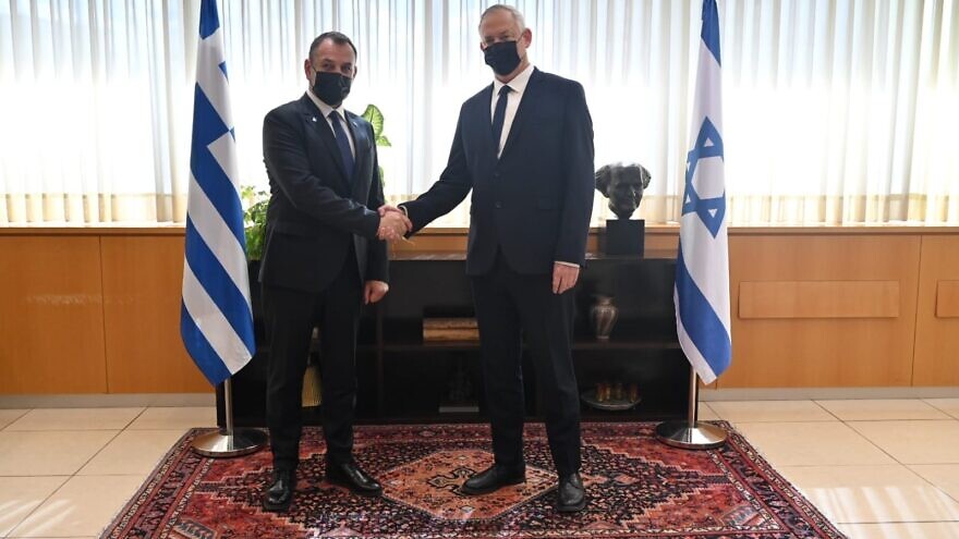 Israeli Defense Minister Benny Gantz greets Greek Defense Minister Nikos Panagiotopoulos at Defense Ministry headquarters in Tel Aviv, Jan. 20, 2022. Credit: Israeli Ministry of Defense.