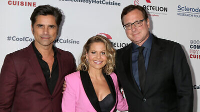 Bob Saget (right) with his “Full House” co-stars John Stamos and Candace Cameron Bure at the Cool Comedy, Hot Cuisine 2019 at the Beverly Wilshire Hotel in Californian on April 25, 2019. Credit: Kathy Hutchins/Shutterstock.