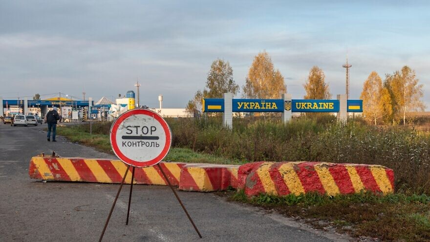 Bachevsk, Ukraine, October 2021: Control sign at the entrance to the Ukrainian checkpoint from Russia. Credit: Fire-fly/Shutterstock.