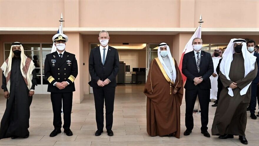 Israeli Defense Minister Benny Gantz (center) in Bahrain, accompanied by senior Israeli military officials, with Bahraini officials upon arrival in Manama, Feb. 2, 2022. Credit: Ariel Hermoni/Israel Ministry of Defense.